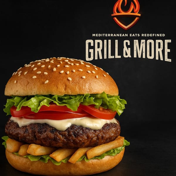 A Mediterranean burger from Grill & More with a sesame bun, patty, lettuce, tomato, sauce, and fries.